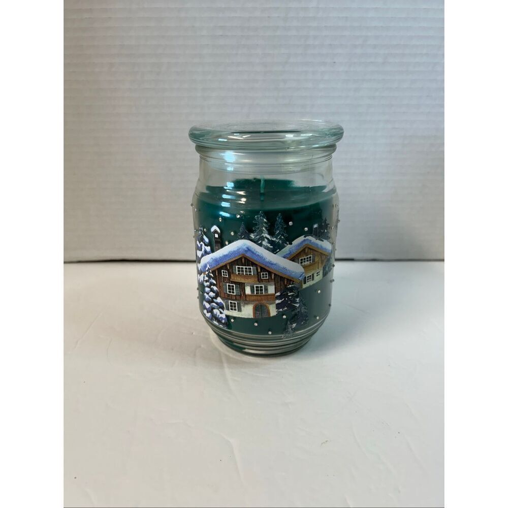 Handmade detailed winter scene with snowy houses and evergreen trees
